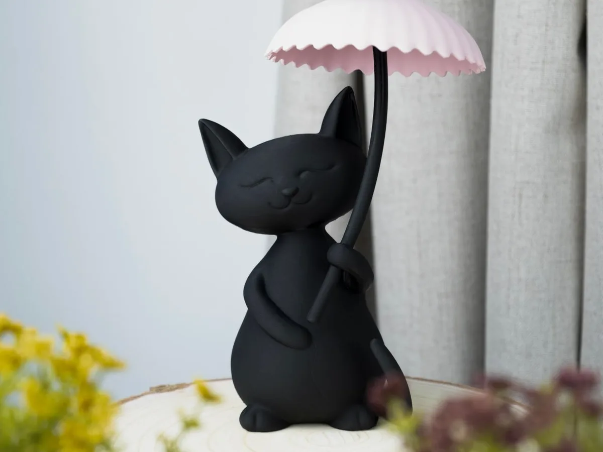 Кот под дождём — скульптура